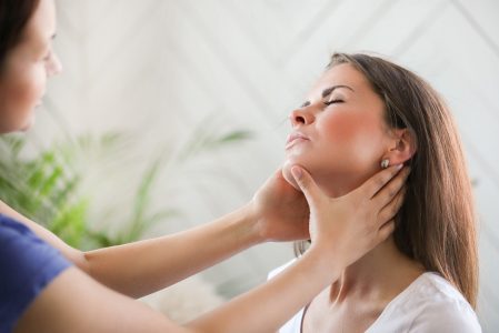 Woman is getting physical therapy from a professional doctor